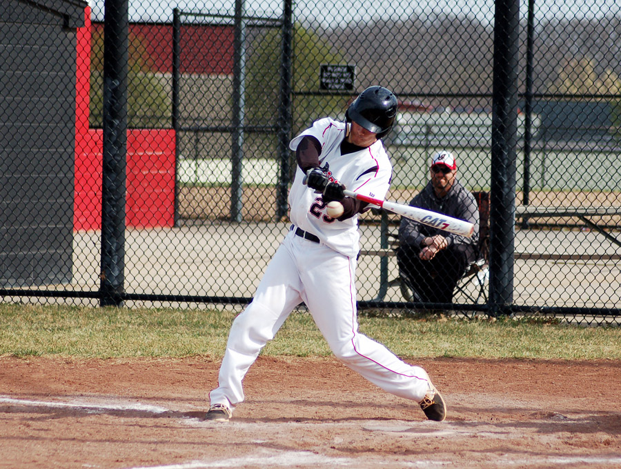 With his eye on the ball, senior Zane Barr swings at a pitch. Barr went 5-5 and batted in three runs. The Indians toppled the William Chrisman Bears 23-3.