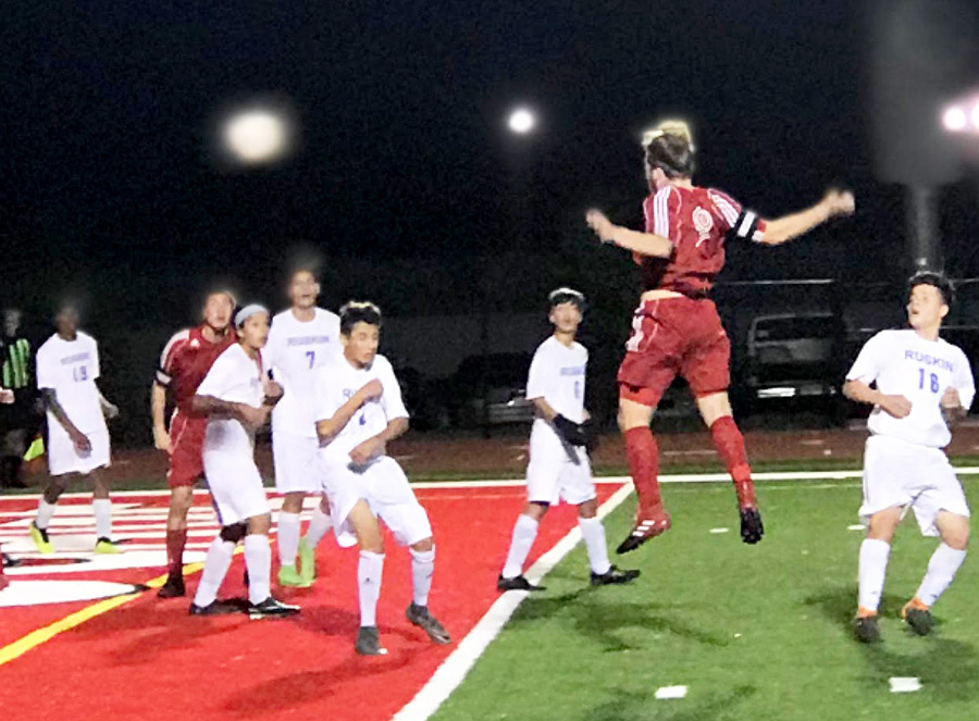 Senior Jacob Lammering (9) heads the ball towards the goal in the first half match against a host of Ruskin defenders. Lammering scored the only two goals of the match to lead the Indians to a 2-0 conference win.