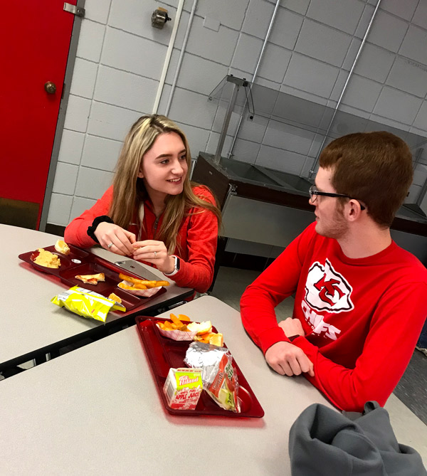 Junior Leara Wright  and Senior Jeremy Likes wear red shirts to celebrate Stoplight Day. Red designated that they were in a relationship. Wearing green meant that a person was single and yellow meant they that it was complicated.