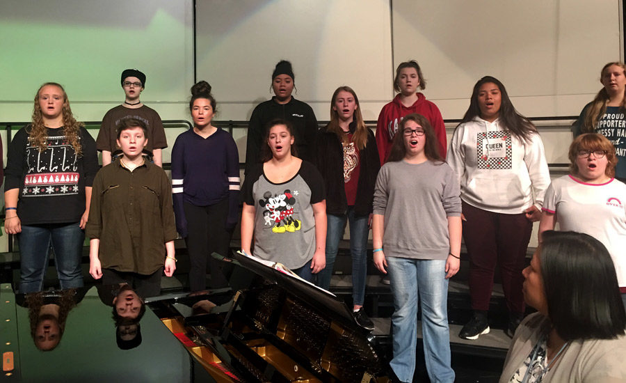 With their eyes on the director, the 3rd period choir class rehearses for the fall concert. All of the high school choirs will perform on Oct. 18, 2018 starting at 7 p.m.