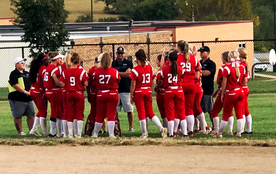The Indian varsity softball team receives feedback from the coaching staff after their 9-2 win over Belton. Fans also celebrated the seniors at their last home game of the season.