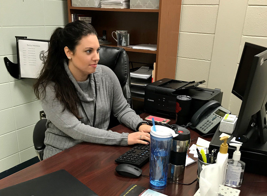 Checking her email, new Mental Health Therapist Ms.Hayley Tlampka settles into her office at OTMS. The district recently contracted with Comprehensive Mental Health to provide counseling services for students.