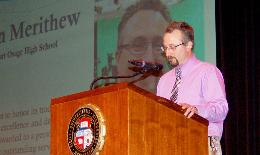 Broadcast Journalism/News Media Teacher Mr. Ben Merithew speaks at the podium during his acceptance speech. He received the Taft Award at the 2019 50th Missouri Interscholastic Press Associations Annual Journalism Day. Its a big deal that people are recognizing you for your service, Mr. Merithew said. We (Journalism Teachers) all serve. 