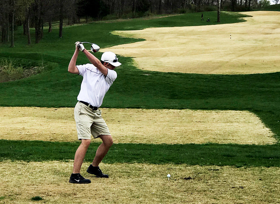 Eyeing+the+fairway%2C+Senior+golfer+Devin+Morrow+gets+ready+drive+the+ball.+Morrow+helped+the+Boys+Varsity+Golf+Team+earn+its+first+ever+Conference+Title.