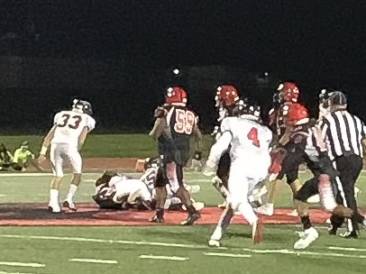 The Indians defense smothers a Cardinal runner during the fourth quarter of their non-conference game on Friday, Aug. 30, 2019. The team lost to Raytown South 6-0.