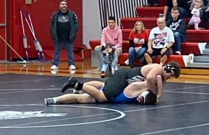 Sinking in a half nelson, sophomore Steven Gabb, III moves his opponent into a near-fall position. Gabb eventually won his 285 lb match by fall to help the Indians move to a 2-0 dual record.
