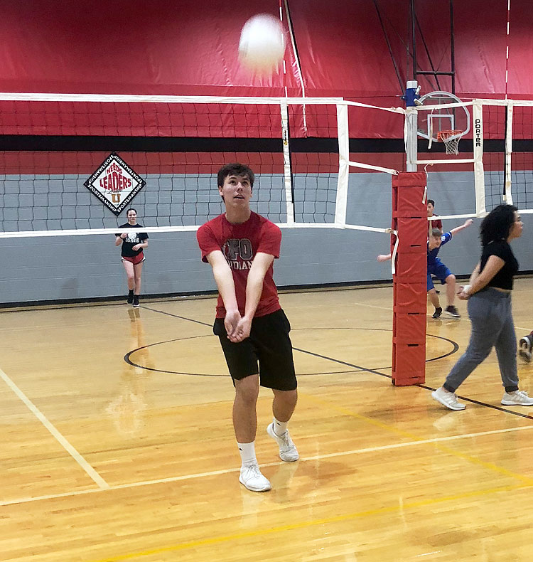 Freshman Dillon Newell works on passing the volleyball in a recent open gym session. Boys were invited to explore the possibilities of starting a Boys Volleyball Club team at he school.