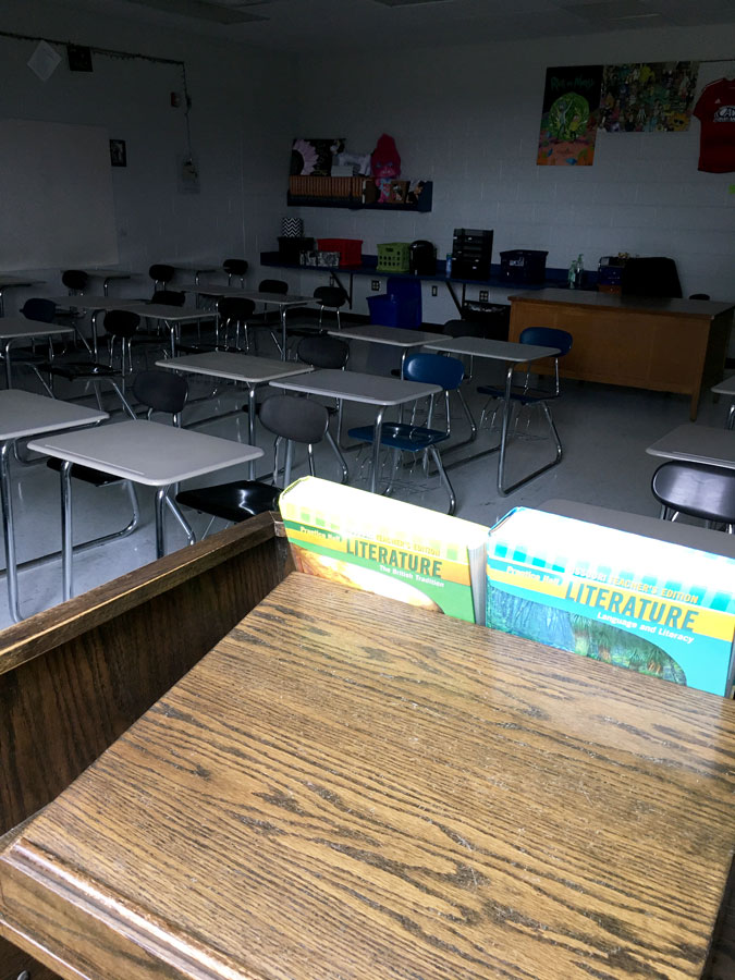 Dimly lit, Ms. Bridget Eischeids English classroom sits vacant. The Fort Osage School District has closed all schools through April 24 in response to the COVID-19 Pandemic.