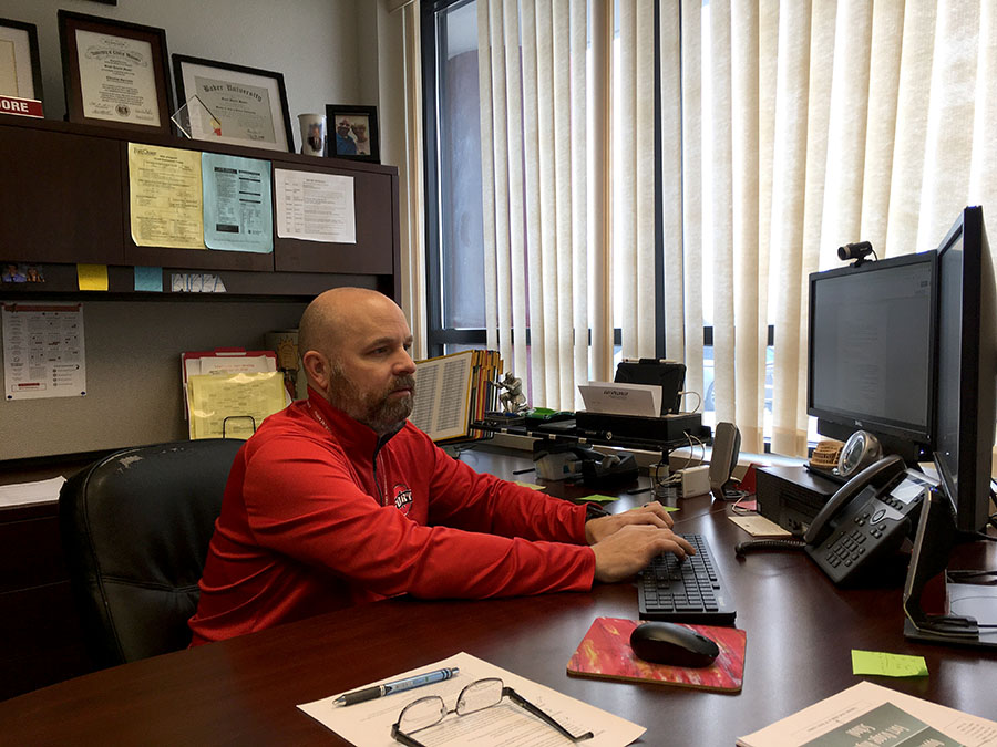 ADAPTING. Head Principal Mr. Scott Moore works at his desk on a virtual day for students. The administration, teachers and students have faced challenges with hybrid and virtual learning and continue to work on best practices to help support each other in the educational process.