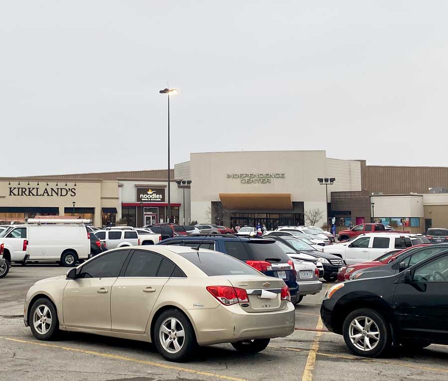 SAFLEY SHOP. Cars sit parked in front of the Independence Center awaiting their drivers after a day of shopping. New curfew policies imposed after recent violence at the shopping hotspot have affected how teens shop at the Center.