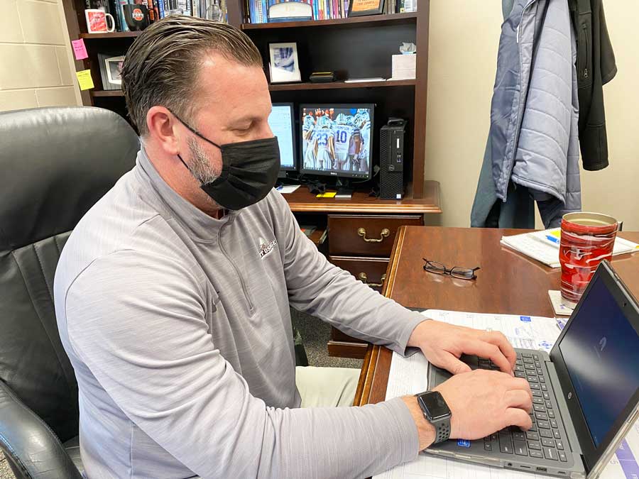 END OF AN ERA. Sitting in his office, Freshman Center Principal Mr. Brad Thompson works on his computer. Mr. Thompson is set to retire at the end of the 2020-2021 school year.