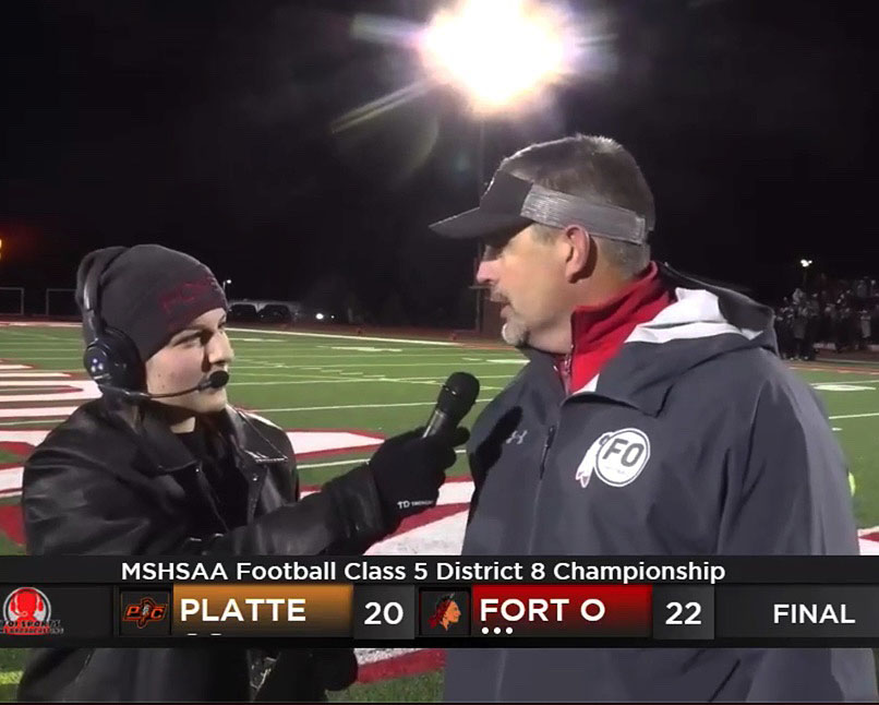 POST+GAME.+Thankful+for+the+win%2C+Head+Football+Coach+Brock+Bult+answers+questions+from+KFOI+Sports+Sideline+Reporter+Jordan+Guenthner+after+the+22-20+win+over+Platte+County.+The+Indians+will+play+Grain+Valley+in+the+Quarterfinal+game+on+Nov.+19.