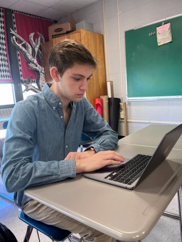 FOCUSED. Senior Evan Funk works quietly on his laptop during class. Funk is the President of the Speech and Debate club as well as a member fo the cross country and track teams.