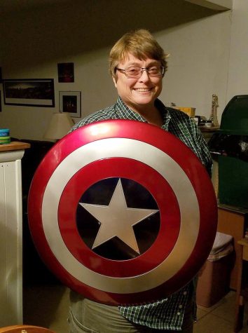 MISSED. Ms. Genevieve “J” Hutter displays the Captain American Shield she obtained for her Marvel collection. Collecting items like this was one of her favorite past times. Ms. Hutter passed away on Jan. 5 after a battle with COVID-19.