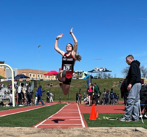 LEAP. Flying off the runway, Senior Dawn McIntyre attempts a long jump at the 60th Annual Bill summa Invitational hosted by William Chrisman High School. McIntyre placed second in the event with a jump of 5.09 meters.
