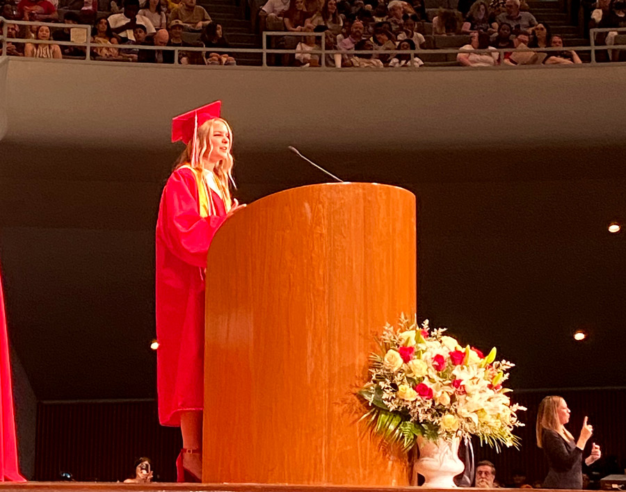GROWING UP. Address her classmates, Senior and now alum Morgan Watkins talks about answering the question, What do you want to be when you grow up? The graduation ceremony returned to the Community of Christ Auditorium after a two year absence due to COVID-19.