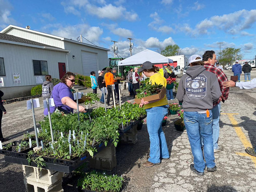 SPRINGING UP. Customers look through the various plants at the FFA’s annual plant sale. Students grew these plants in the Career and Technical Center’s greenhouse.