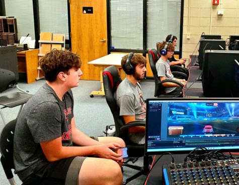 ROCKET LEAGUE. (From L to R) Sophomore Isaac Woodward watched Senior Grayson Bodendieck, Sophomore Zartie Perry, and Sophomore Alexander Davis take on the Ruskin varsity Rocket League Team. This is the first varsity Rocket League team in Fort Osage high school history. “This is all very new to me and our school,” Davis said. “But I can tell this will prove to be a very fun experience for our school.”