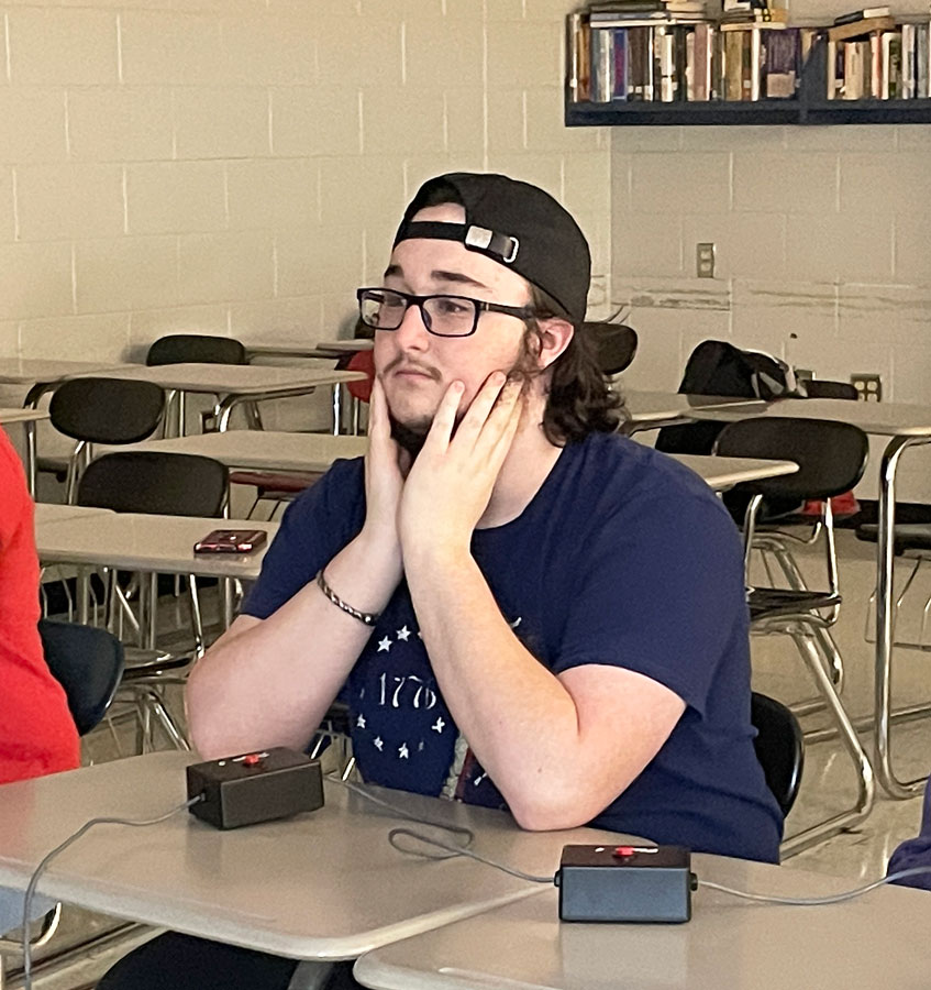 DEDICATION. Senior Jaydon Osborne listens to questions during a recent scholar bowl practice.  Osborne has attended seven tournaments during his time in scholar bowl. “Tournaments are always really fun,” Osborne said. “And we have a lot of memorable moments.”