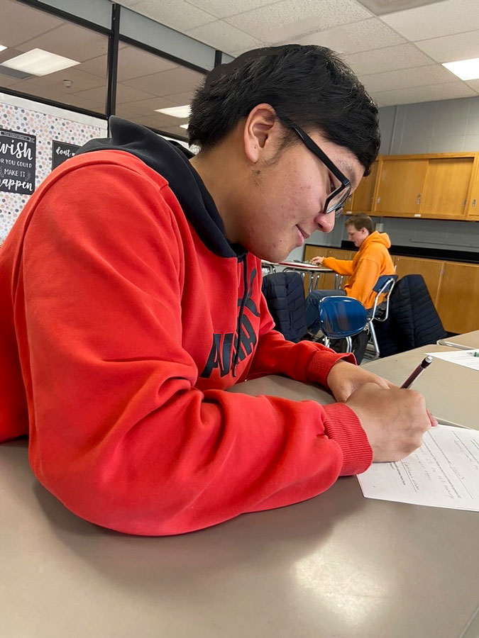 STUDYING. Senior Jacob Pahayo goes over his assignment in Anatomy. Pahayo’s favorite soccer memory is the bus rides home. “When the buses were not cramped, they were really fun. I have a lot of good memories from them.”