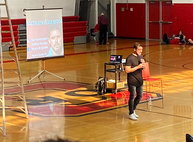 INSPIRE. Speaker Nathan Harmon provides a talk in an attempt to encourage the crowd. He started speaking at schools and public conferences in 2017. “I hope people that hear it find the courage to step into their story and realize that it’s okay to not be okay but it’s not okay to stay that way,” Mr. Harmon said.