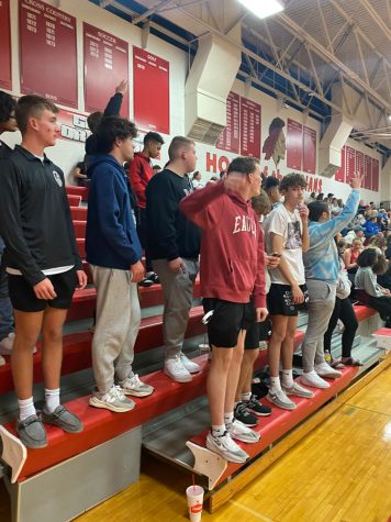 SUPPORT.  Students cheer at a basketball game this past winter. The Signal Staff has notice a decline in school spirit and encourages students to attend games and assemblies to show support for the schools teams and activities.