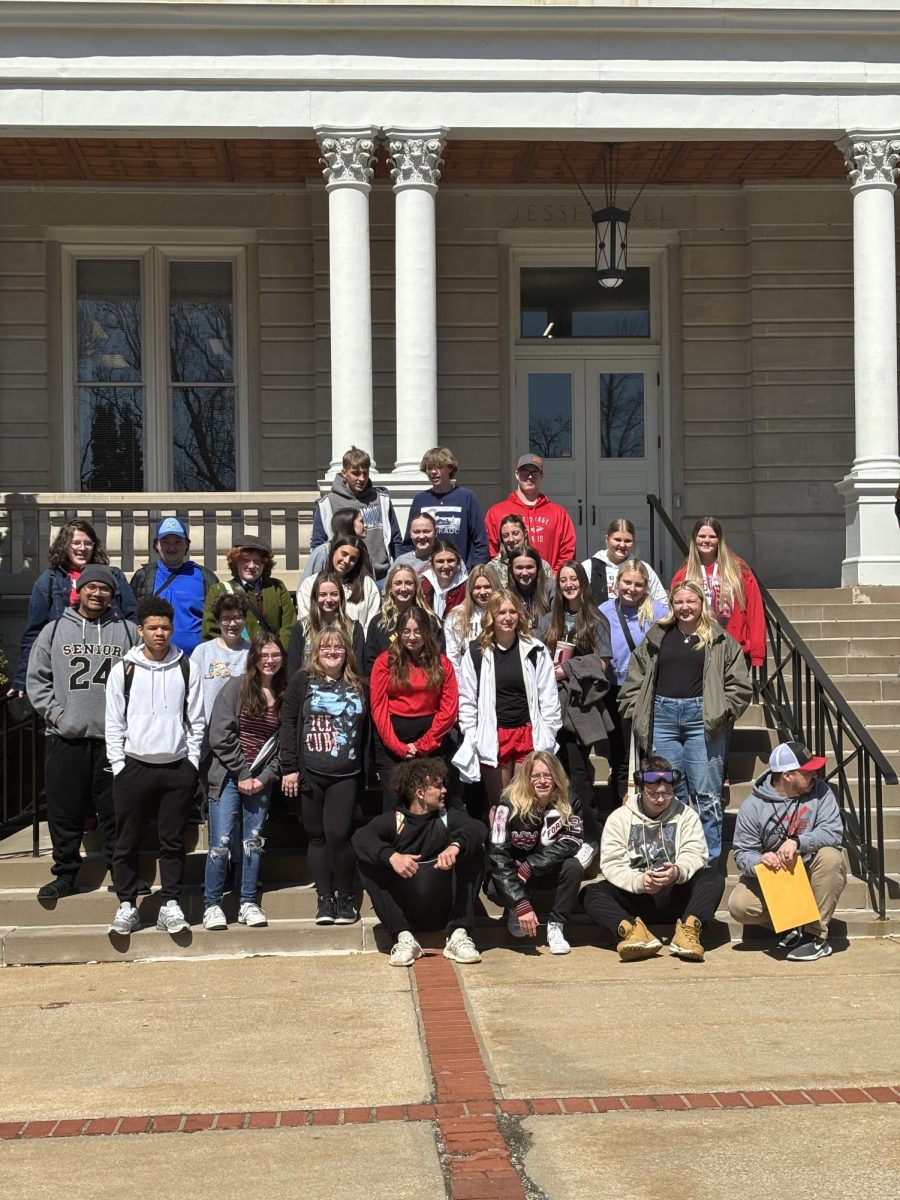 The Staff of Fort Osage High School News Media stand in front of Jesse Hall, on the University of Missouri campus. The staff had to arrive at the high school at 6 AM in order to get to Mizzou on time to start the day.