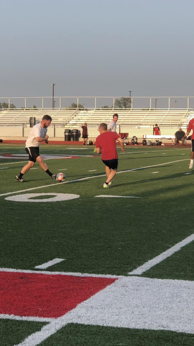 BREAK AWAY. JV boys soccer coach Keegan Lammering (white) takes off down the field to the goal. Lammering lead his team with 2 goals but came up short in the end. All the Alumni got to remember what being apart of a team feels like. Jennifer Kudzinski thinks the team is what makes soccer so fun. 
"The memory of the comradery," Kudzinski said.