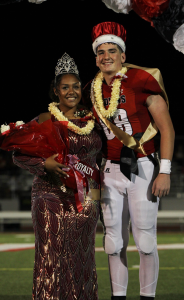 CHEESIN. Seniors Lupe Yamauchi (L) and Isaac Woodward (R) smile together after being crowned Homecoming King and Queen. Yamauchi is the Student Body President, Woodward is a STUCO Officer. "It felt really nice to win with Isaac," Yamauchi said.