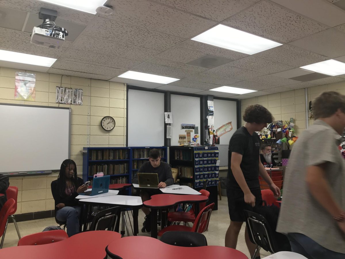 PREPARING. Senior Bradyn Banasik constructs a case for his public forum debate. 