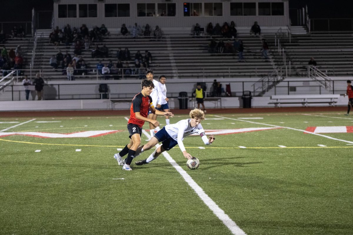 FOUL. Junior Blake Overbeck (2) fouls William Chrisman defender. Overbeck went on to score to help the Indains win 8-0. Coach Ra Del Hinckley beileives this team can win big. 
"We can play with any team in the conference, we can be successful against any team," Hinckley said. 