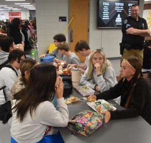 Brooklyn Cooper and Lily Kruk, juniors, spent lunch time chatting with friends rather than being on their cell phones. 