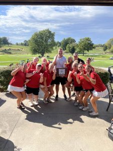 The Fort Osage Girls Golf Team celebrates after winning conference for the first time in program history